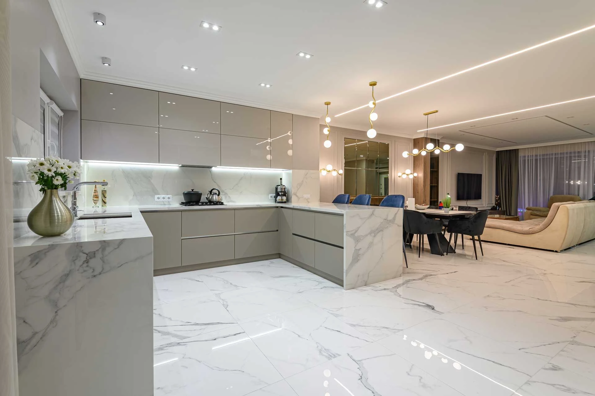 A large kitchen with a marble counter top.