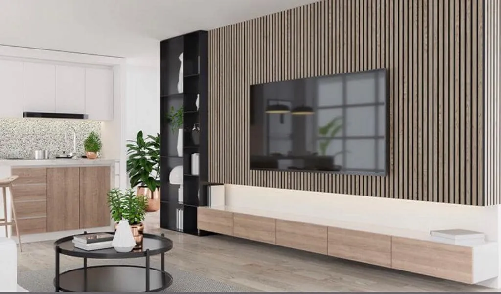 A modern living room with a large television on the wall.